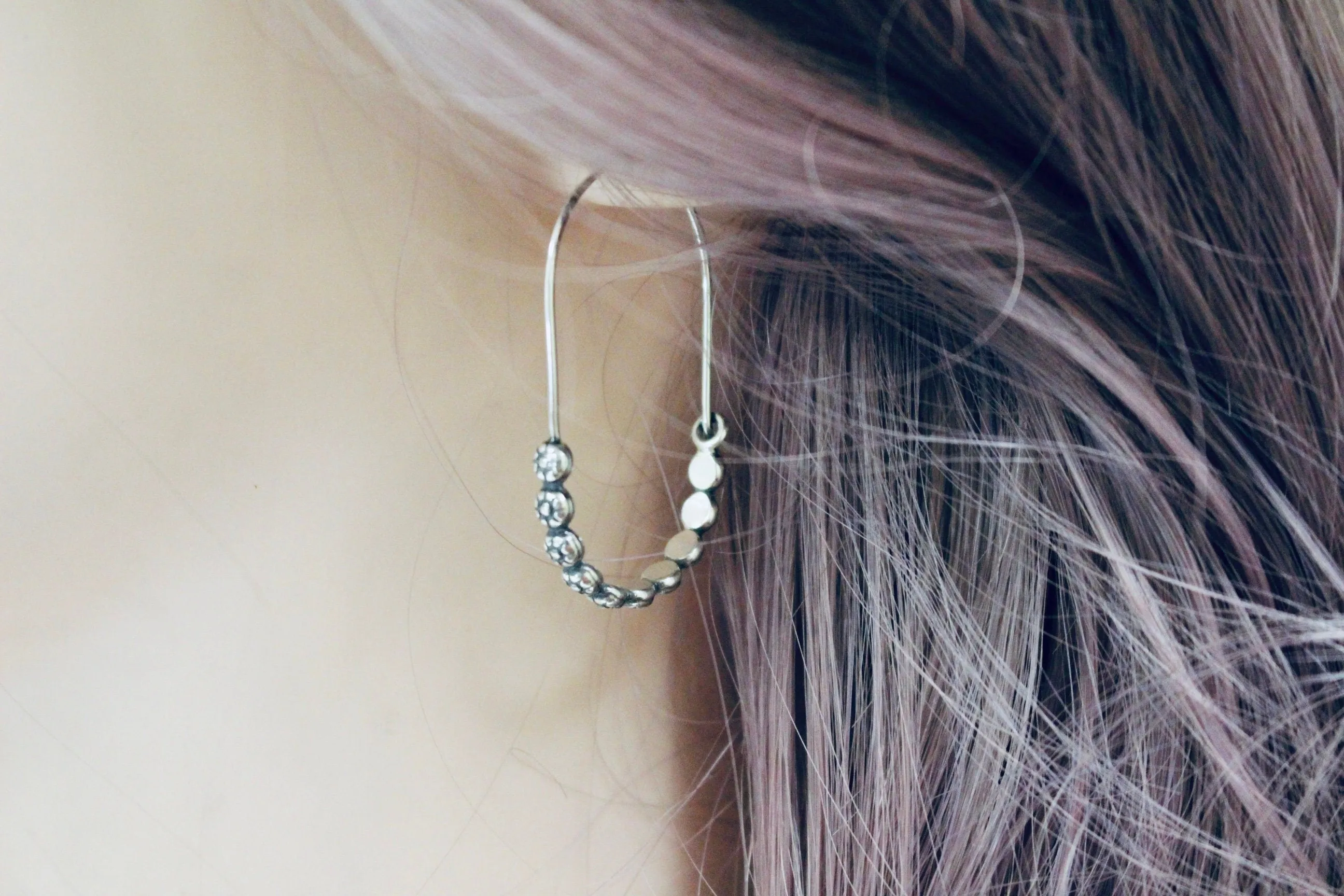 Floral sterling silver hoop earring