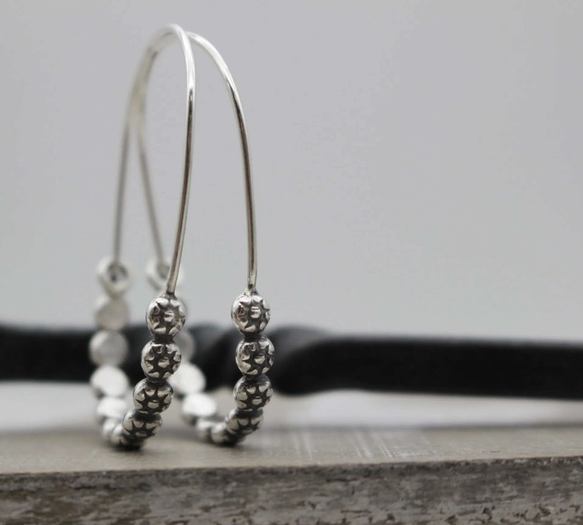 Floral sterling silver hoop earring