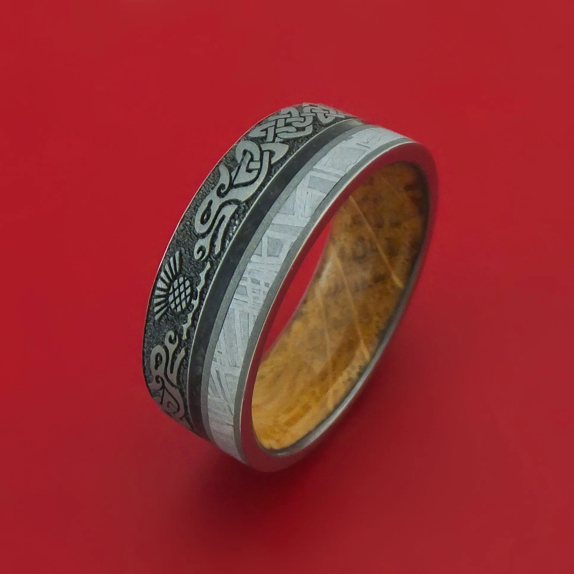 Titanium Dragon Celtic Ring with Meteorite and Dinosaur Bone along with a Hardwood Sleeve