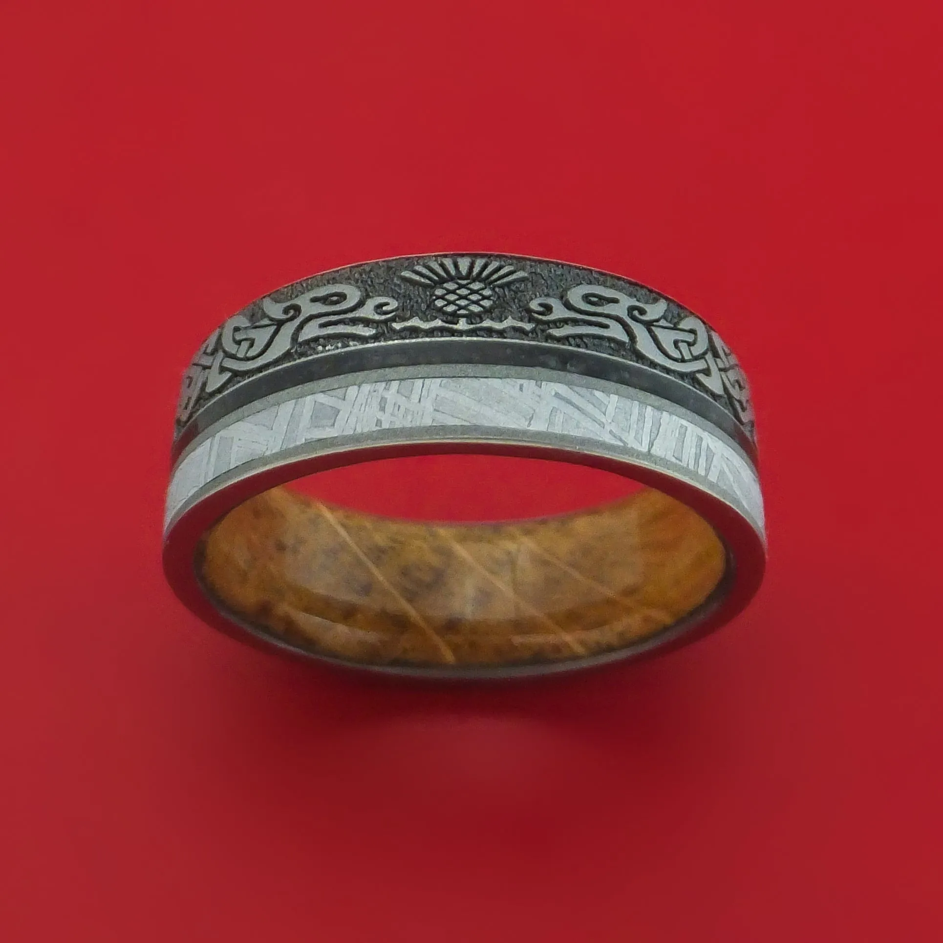 Titanium Dragon Celtic Ring with Meteorite and Dinosaur Bone along with a Hardwood Sleeve